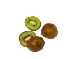 Two unpeeled kiwis, cut in half.  Slice. photo