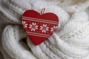 Valentine heart on a white scaf. Background for Valentines day greeting card, concept of romantic celebration.winter photo