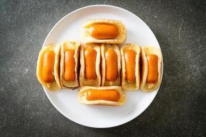 flat pancake roll with sausage photo