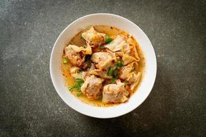 pork wonton soup or pork dumplings soup with roasted chili photo