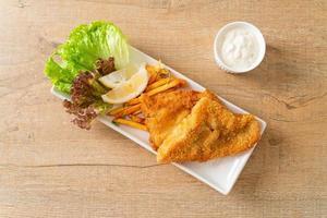 fish and chips - fried fish fillet with potatoes chips photo