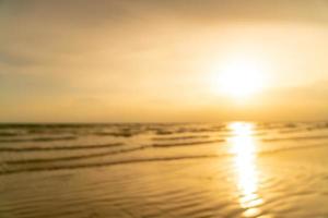 abstract blur beautiful sea beach with sunset time for background photo