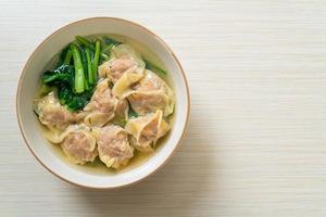 pork wonton soup or pork dumplings soup with vegetable photo