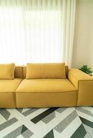 empty yellow fabric sofa in living room photo