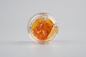 orange golden extract dab cannabis in bottle photo