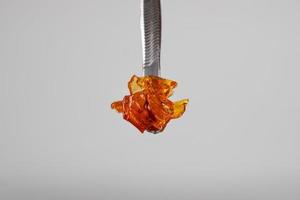 marijuana wax smear, cannabis dab with stick photo