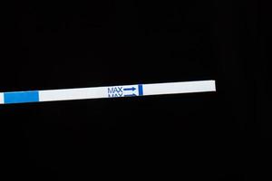 pregnancy test closeup on a dark background photo