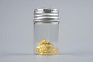 piace cannabis extract wax with transparent bottle closeup on gray background photo