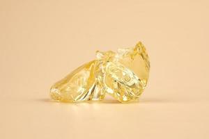 yellow wax piece with high THC, clear cannabis resin stone photo