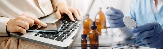 Medicine doctor hand working on a patients x-ray scans digital healthcare and connection with modern virtual screen interface icons, Medical technology and network concept. photo