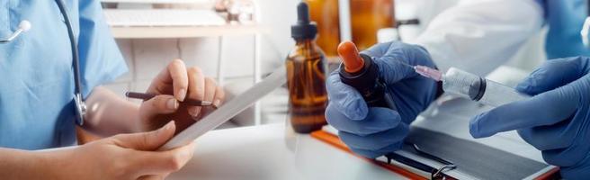 Medicine doctor hand working on a patients x-ray scans digital healthcare and connection with modern virtual screen interface icons, Medical technology and network concept. photo