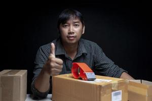 man doing thumbs up gesture Show satisfaction with starting an online trading business. photo