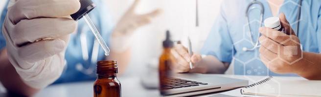 Medicine doctor hand working on a patients x-ray scans digital healthcare and connection with modern virtual screen interface icons, Medical technology and network concept. photo