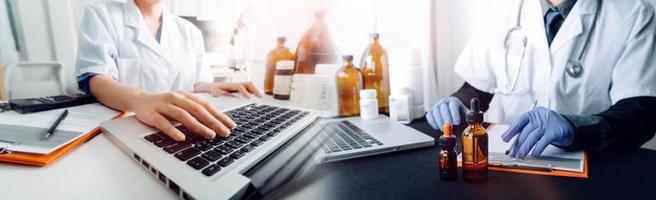 Medicine doctor hand working on a patients x-ray scans digital healthcare and connection with modern virtual screen interface icons, Medical technology and network concept. photo