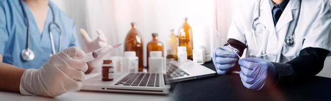 Medicine doctor hand working on a patients x-ray scans digital healthcare and connection with modern virtual screen interface icons, Medical technology and network concept. photo