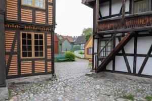 Oslo, Norway. May 29, 2022. Cobblestone street and a view of town at The Norwegian Museum of Cultural History in Oslo. photo