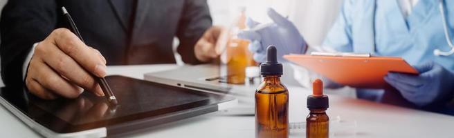Medicine doctor hand working on a patients x-ray scans digital healthcare and connection with modern virtual screen interface icons, Medical technology and network concept. photo
