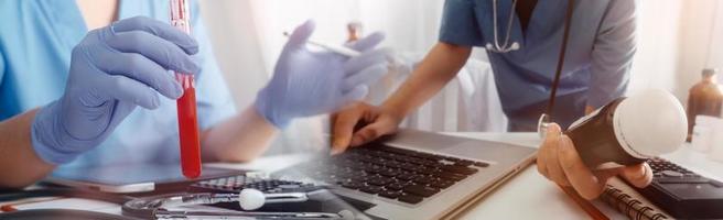 Medicine doctor hand working on a patients x-ray scans digital healthcare and connection with modern virtual screen interface icons, Medical technology and network concept. photo
