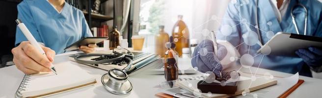 Medicine doctor hand working on a patients x-ray scans digital healthcare and connection with modern virtual screen interface icons, Medical technology and network concept. photo