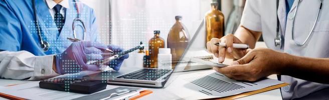 Medicine doctor hand working on a patients x-ray scans digital healthcare and connection with modern virtual screen interface icons, Medical technology and network concept. photo