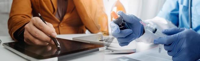 Medicine doctor hand working on a patients x-ray scans digital healthcare and connection with modern virtual screen interface icons, Medical technology and network concept. photo