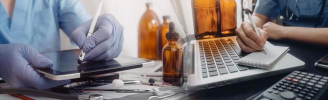 Medicine doctor hand working on a patients x-ray scans digital healthcare and connection with modern virtual screen interface icons, Medical technology and network concept. photo