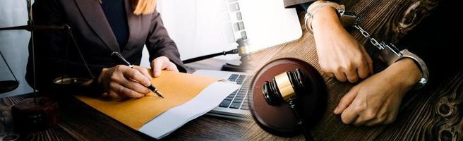 Business and lawyers discussing contract papers with brass scale on desk in office. Law, legal services, advice, justice and law concept picture with film grain effect photo