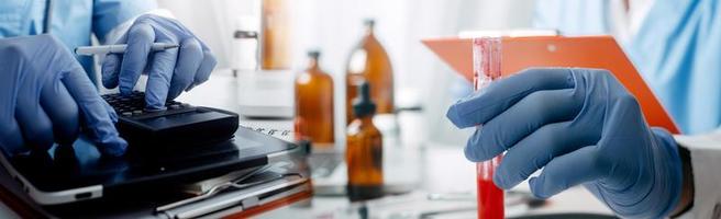 Medicine doctor hand working on a patients x-ray scans digital healthcare and connection with modern virtual screen interface icons, Medical technology and network concept. photo