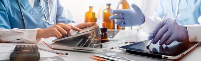 Medicine doctor hand working on a patients x-ray scans digital healthcare and connection with modern virtual screen interface icons, Medical technology and network concept. photo