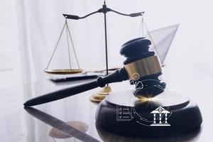 justice and law concept.Male judge in a courtroom on wooden table and Counselor or Male lawyer working in office. Legal law, advice and justice concept. photo