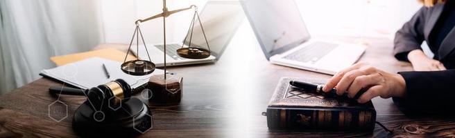 Business and lawyers discussing contract papers with brass scale on desk in office. Law, legal services, advice, justice and law concept picture with film grain effect photo