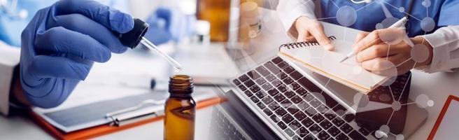 Medicine doctor hand working on a patients x-ray scans digital healthcare and connection with modern virtual screen interface icons, Medical technology and network concept. photo