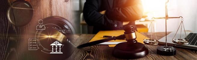 Business and lawyers discussing contract papers with brass scale on desk in office. Law, legal services, advice, justice and law concept picture with film grain effect photo