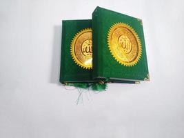 Depok, West Java, Indonesia , 2022, yasin's book which is often read by Muslims after prayer. green cover isolated on a white background photo