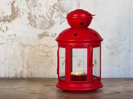 Red Christmas Lamp isolated on wall background. photo
