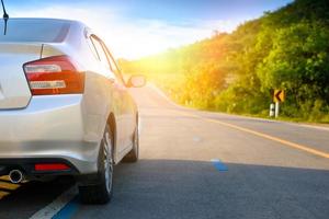 Close up of new silver hatchback car parking on local road photo