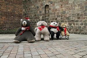 Giant teddy bears sitting in an old street in Berlin, Germany photo