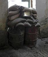 Abandoned house with sandbags at the window  in the buffer zone Green Line in Nicosia, Cyprus photo