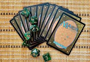 Dice game green polyhedral, MTG dice and cards. photo