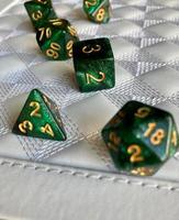 Dice game green polyhedral, MTG dice and cards. photo