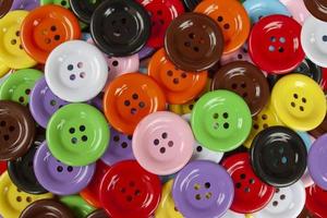 Top view of Colorful Button is a device for the seam of the fabric for background. photo