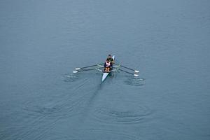 Bilbao, Vizcaya, Spain, 2022 - athletes training in a canoe on the Nervion River in Bilbao, basque country, spain photo