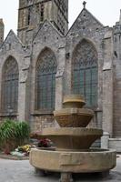 Antique stone fountain, Vasque de Keilinsky, in front of the Cathedral. Saint Pol de Leon, France photo