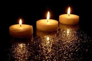 Three light candles photo