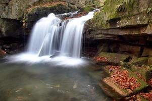Autumn waterfall and stones photo