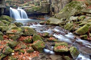 Autumn waterfall and stones photo