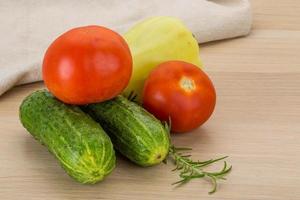 Fresh vegetables on wooden background photo