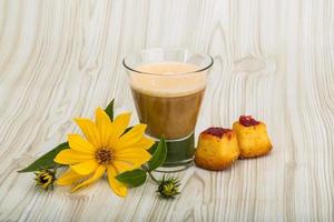 Coffee with milk on wooden background photo