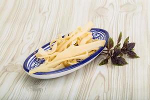 Dry calamari in a bowl on wooden background photo