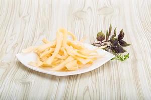 Dried squids on the plate and wooden background photo